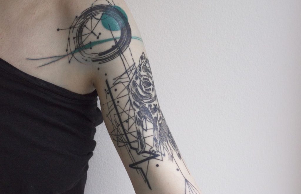 avant garde tattoo style on arm