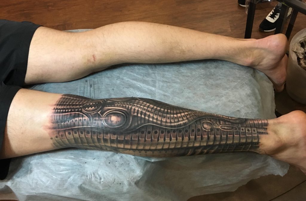 biomechanical tattoo on leg